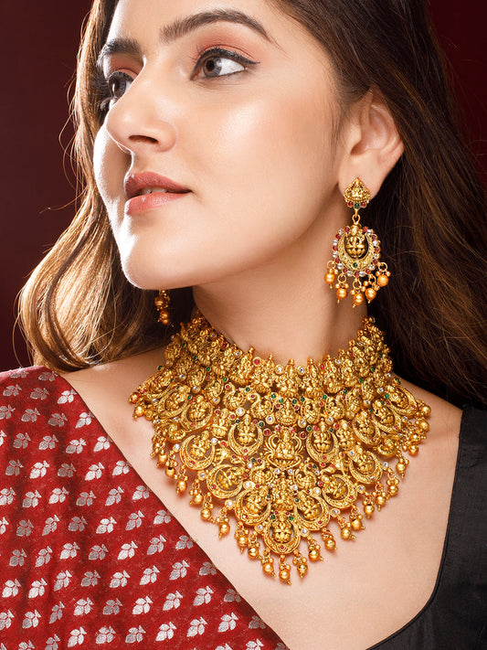 Rubans 22K Gold Plated Red, Green & White Stone Studded Lakshmi Motif Temple Jewellery Set Gold