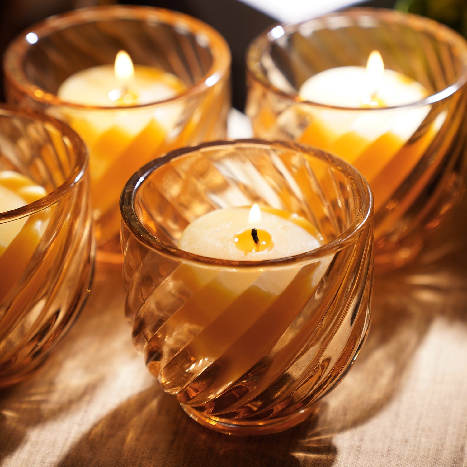Set of 4 Light Amber Swirl Cut Tealight Holders