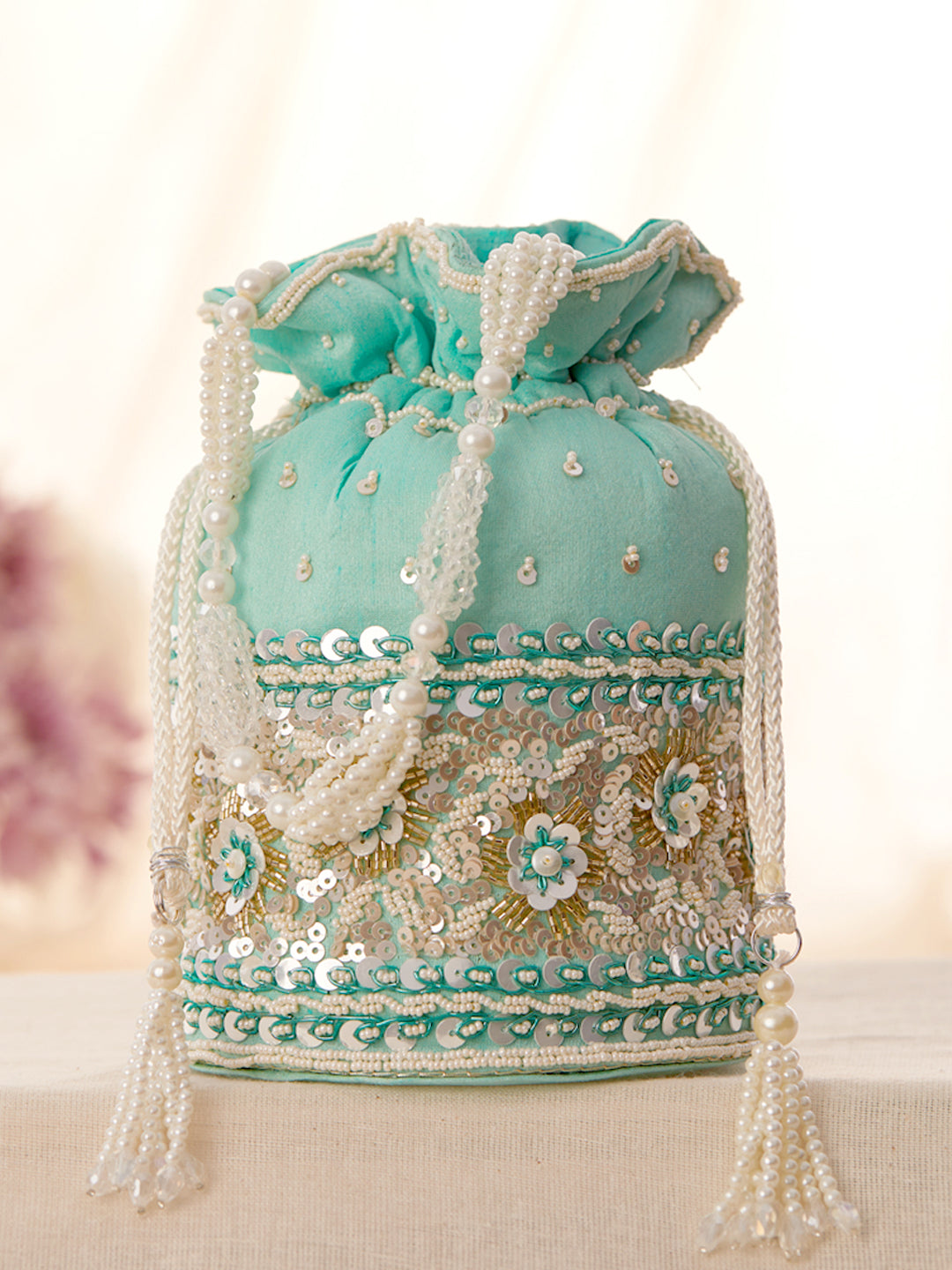 Rubans Mint Coloured Potli Bag With Golden And White Embroided Design. Turquoise Blue