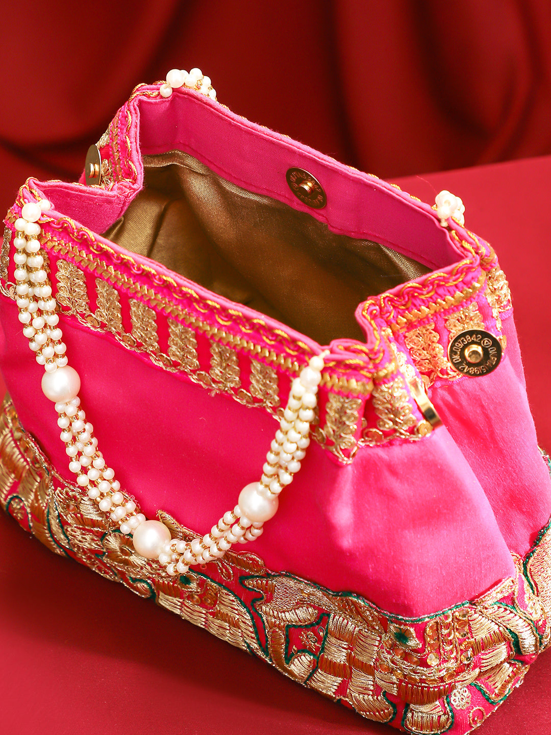 Rubans Pink Silk Potli Bag with Pearl Handle and Intricate Elephant Motif Embroidery Pink