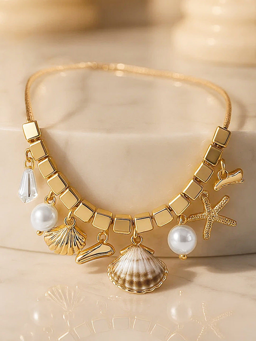 【Rubans】 Gold Toned Multi-Charm Necklace｜ゴールドトーン マルチチャーム ネックレス（ステンレススチール）