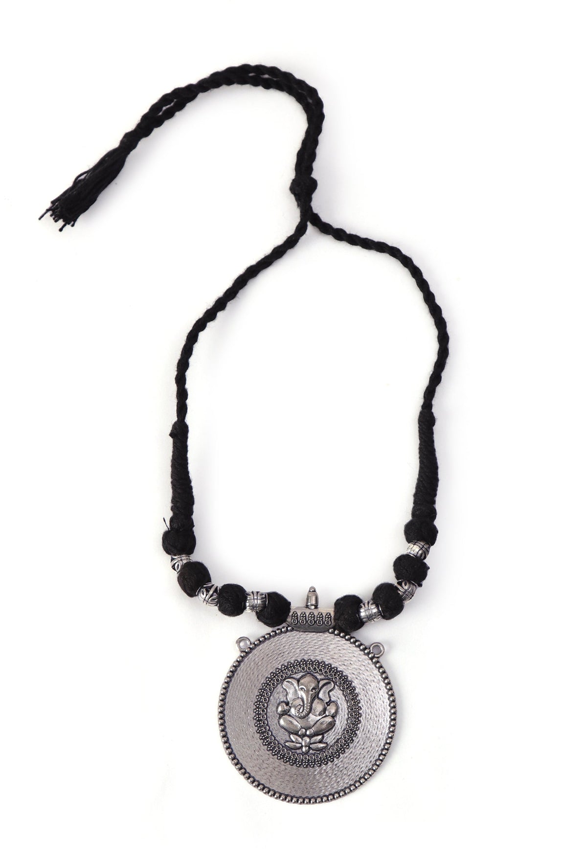 Rustic Charm: Ganesha Silver Pendant with Tribal Dori