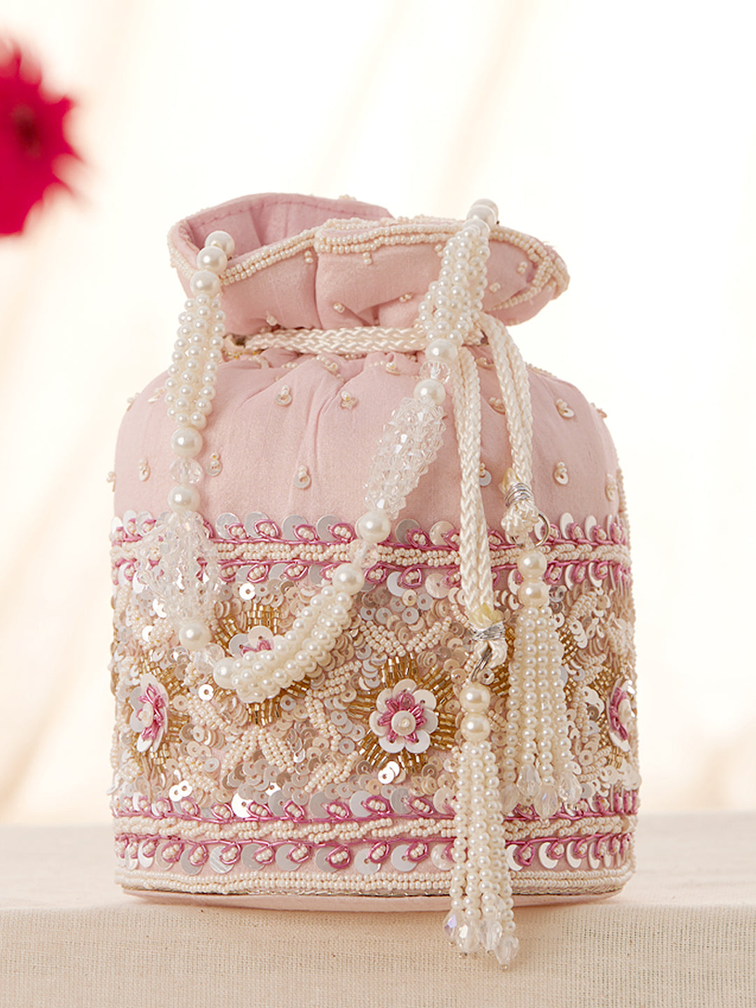 Rubans Pink Coloured Potli Bag With Golden And White Embroided Design. Pink