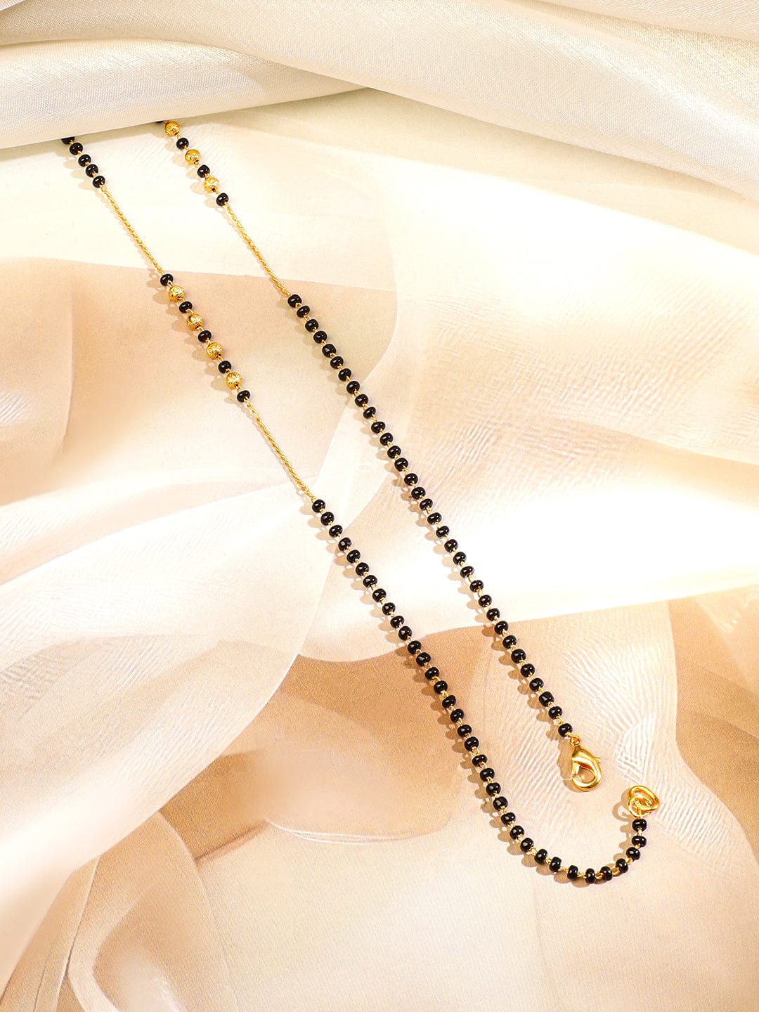 Rubans 18K Gold-Plated White Cubic Zirconia Studded Floral & Teardrop Pendant Mangalsutra with Black & Gold Beaded Chain Gold